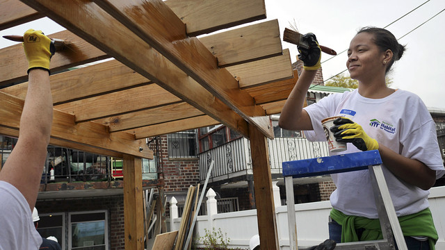 A volunteer helps rebuild a house for Habitat for Humanity in Coney Island, N.Y., on Wednesday. ASSOCIATED PRESS
